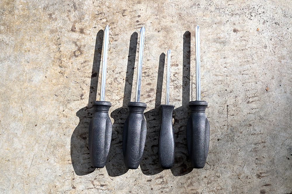Four Black Handled Screwdrivers