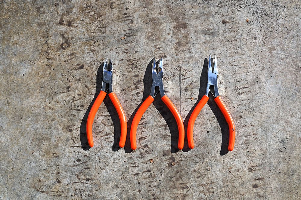 Three Orange Handled Pliers