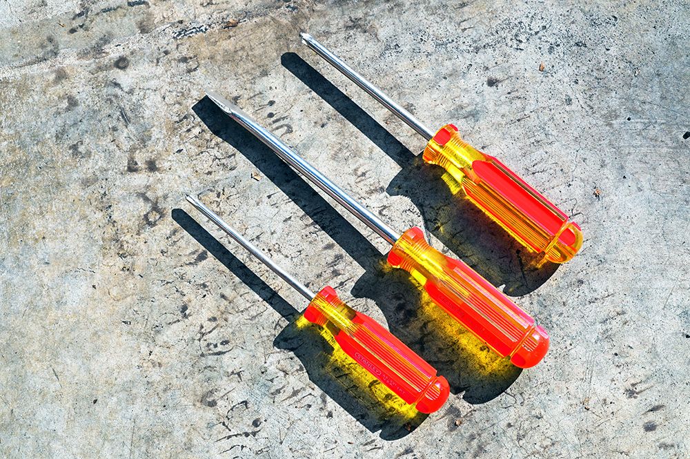 Three Red And Yellow Screwdrivers