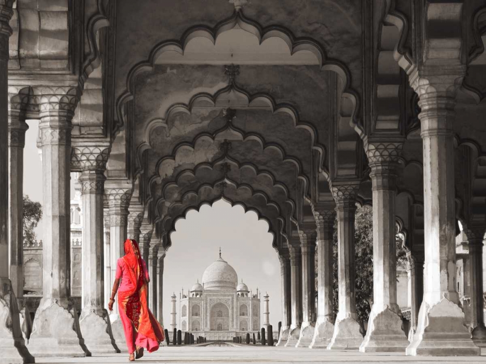 Woman in traditional Sari walking towards Taj Mahal