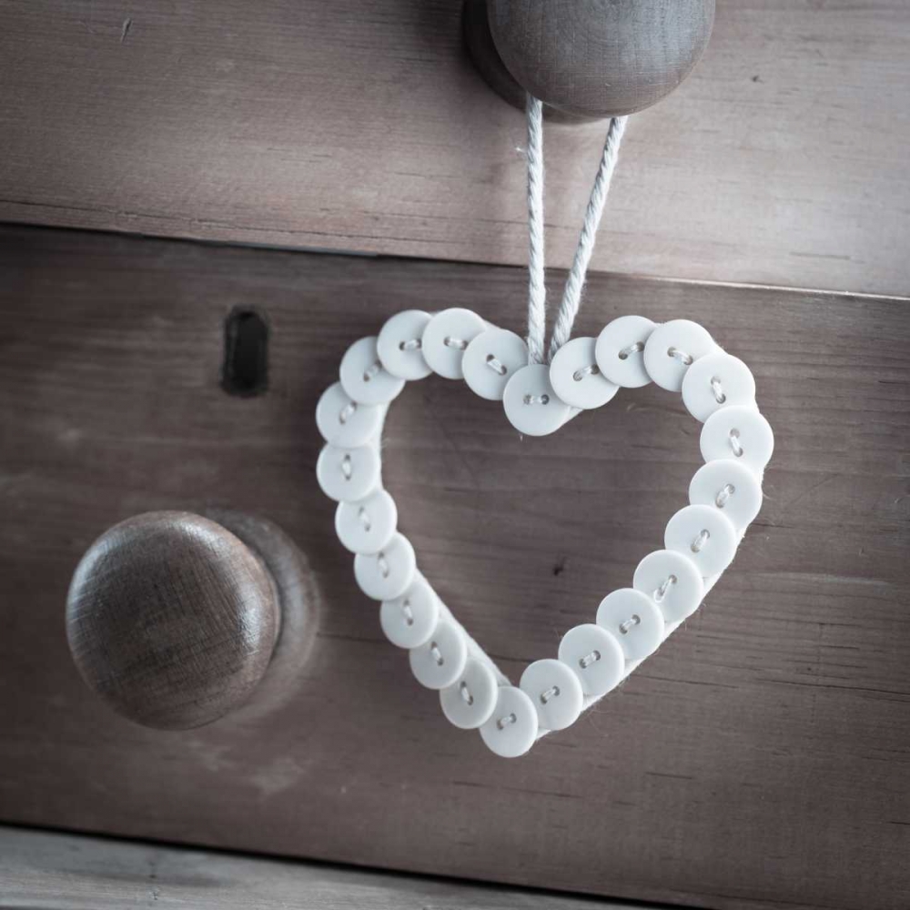 heart made of buttons hunging on a handle