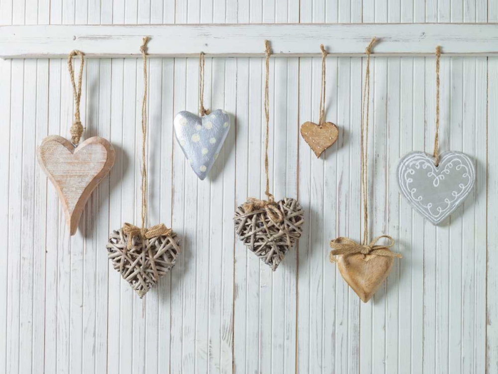 Hearts hanging on wooden background