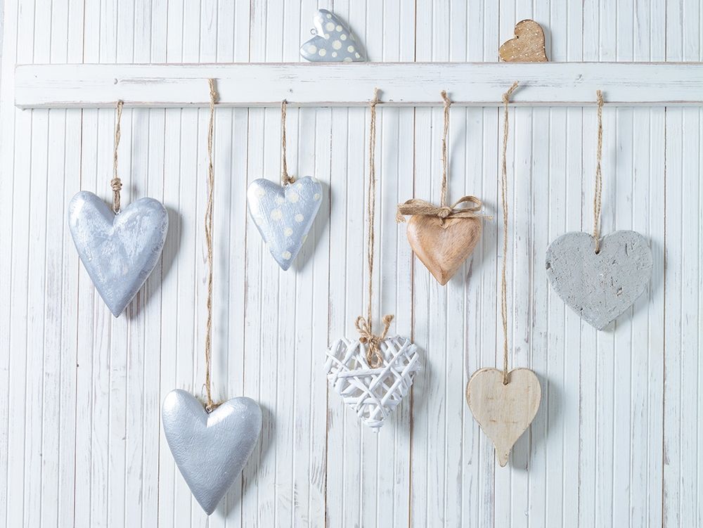 Hearts hanging on wooden background