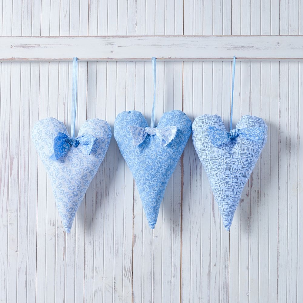 Hearts hanging on wooden background
