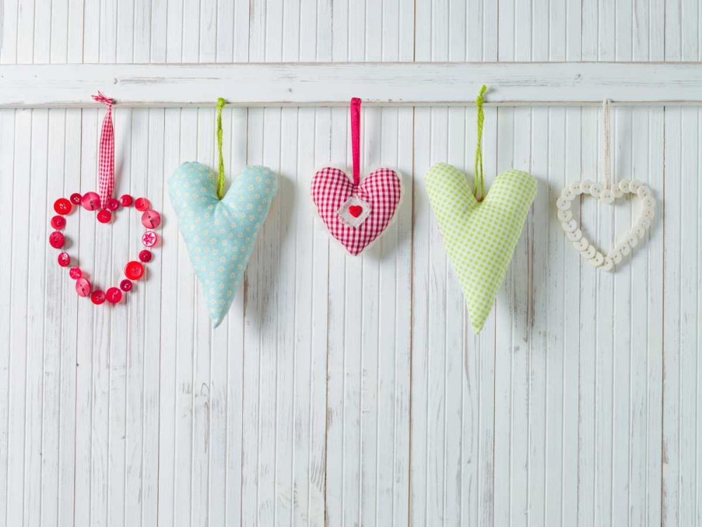 Hearts hanging on wooden background