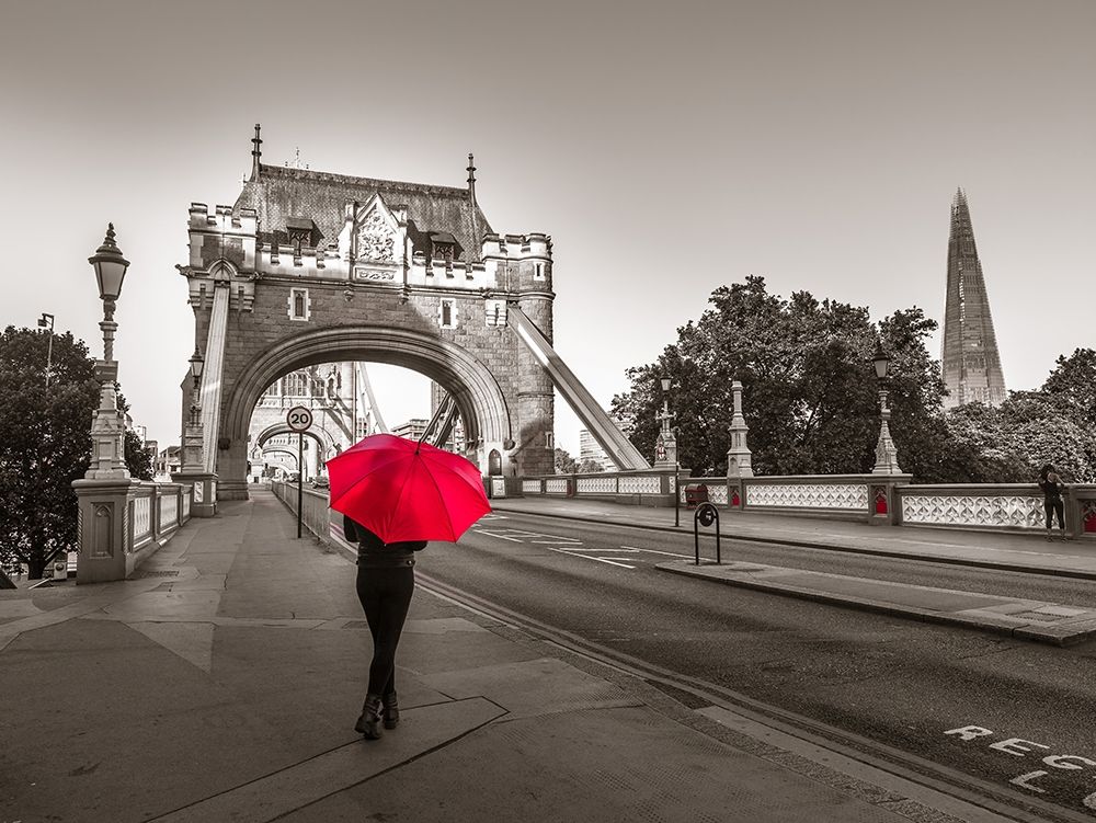 Tourist with umbrella on Tower Bridge, London, UK