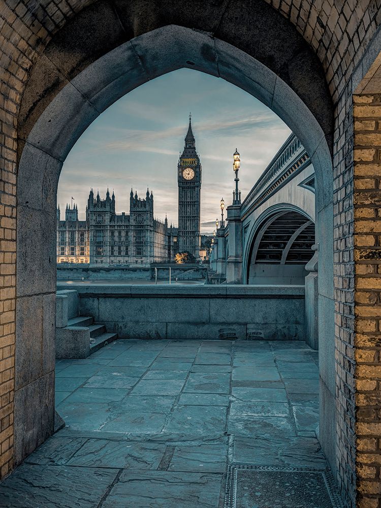 View of Westminster Abby and Big Ben from Thames promenade arch, London, UK