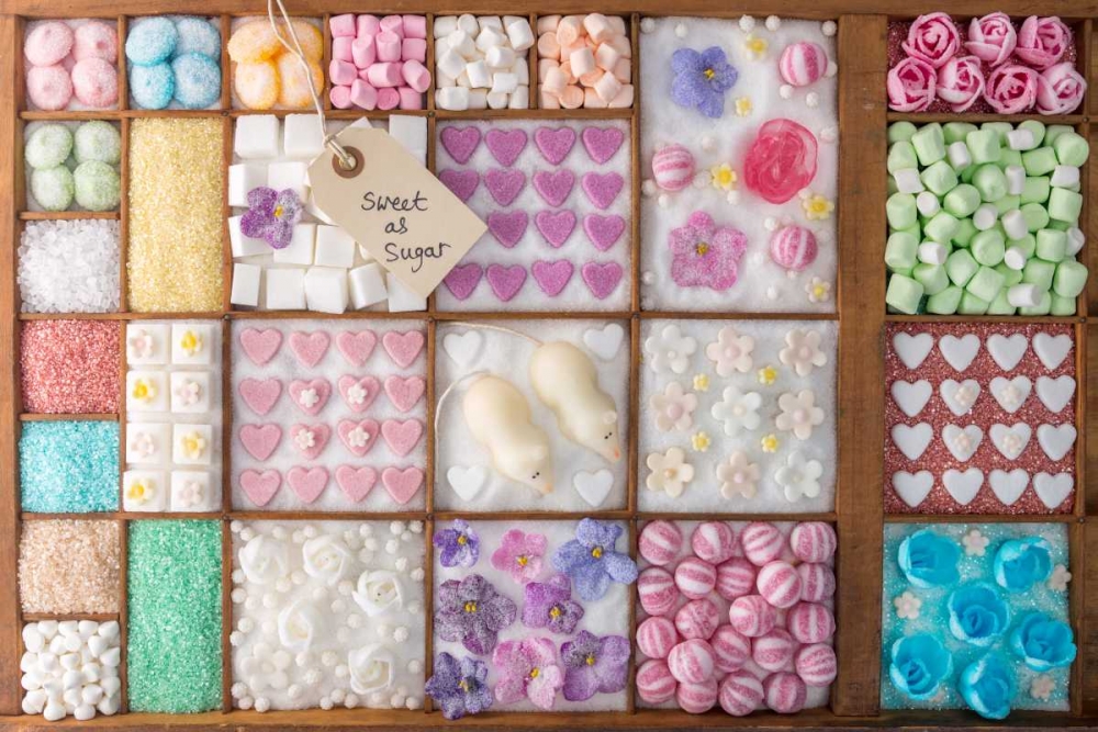 Mix of candies and sweets in wooden box