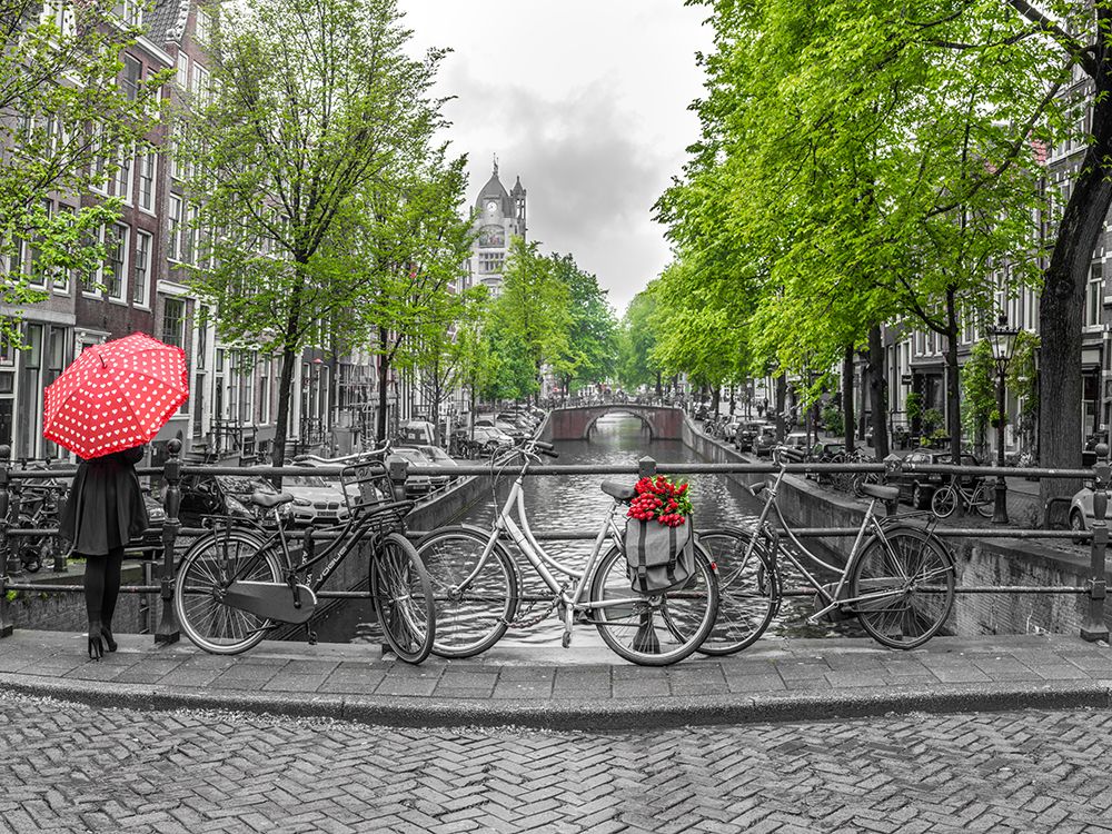 Woman with umbrella by the canal, Amsterdam