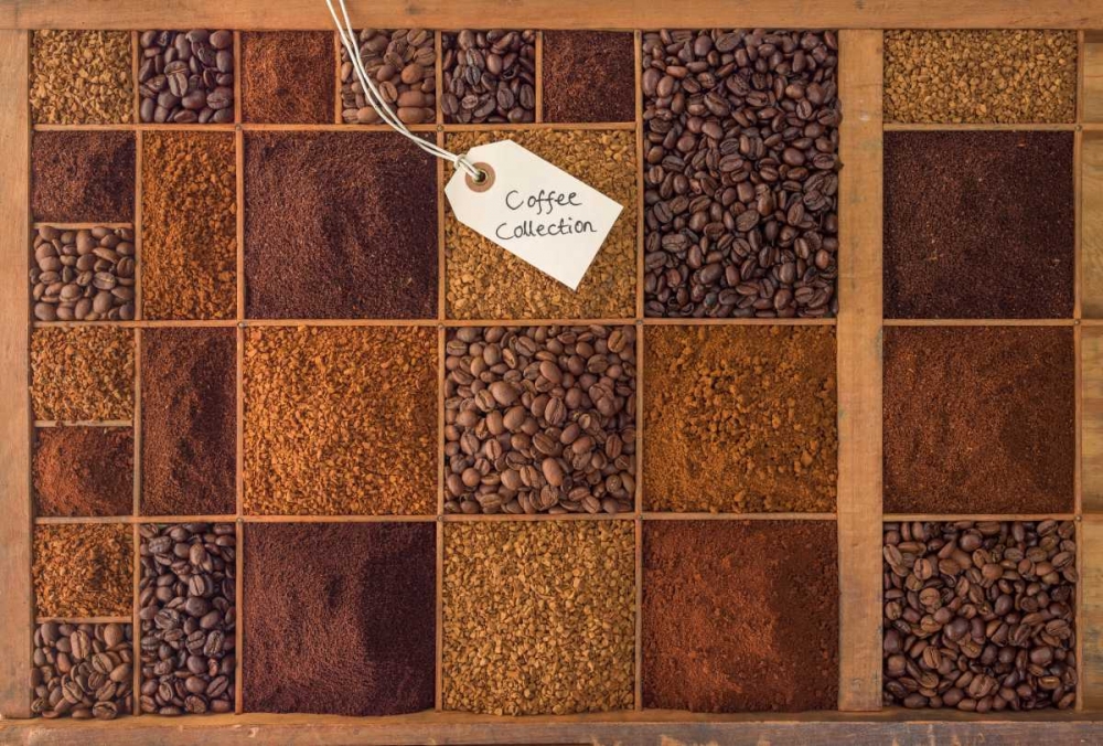 Variety of coffee beans in a wooden box