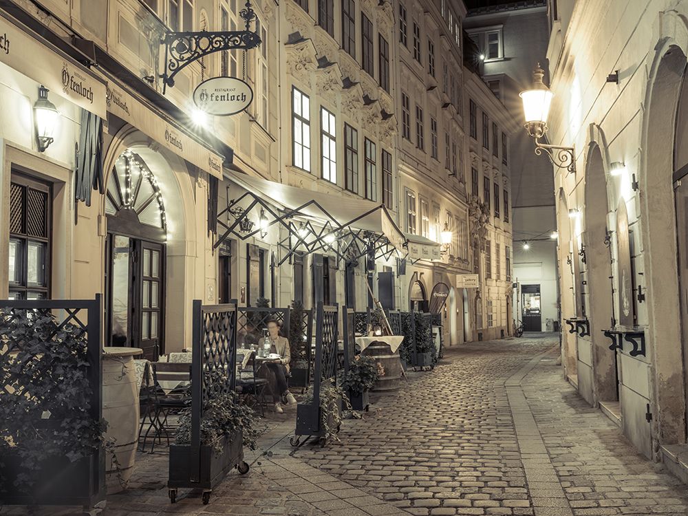 Evening view of street cafe in Vienna, Austria