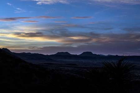 Sunset over the low mountains in the rugged terrain north of Big Bend National Park in the Trans-Pe