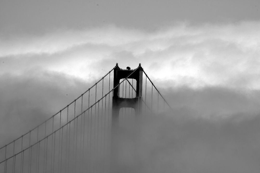 Golden Gate Bridge with fog rolling over it San Francisco California