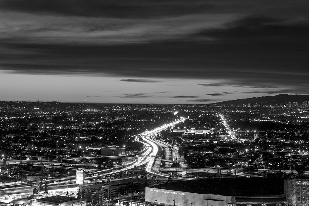 Dusk skyline view of Los Angeles California looking west over the Santa Monica freeway