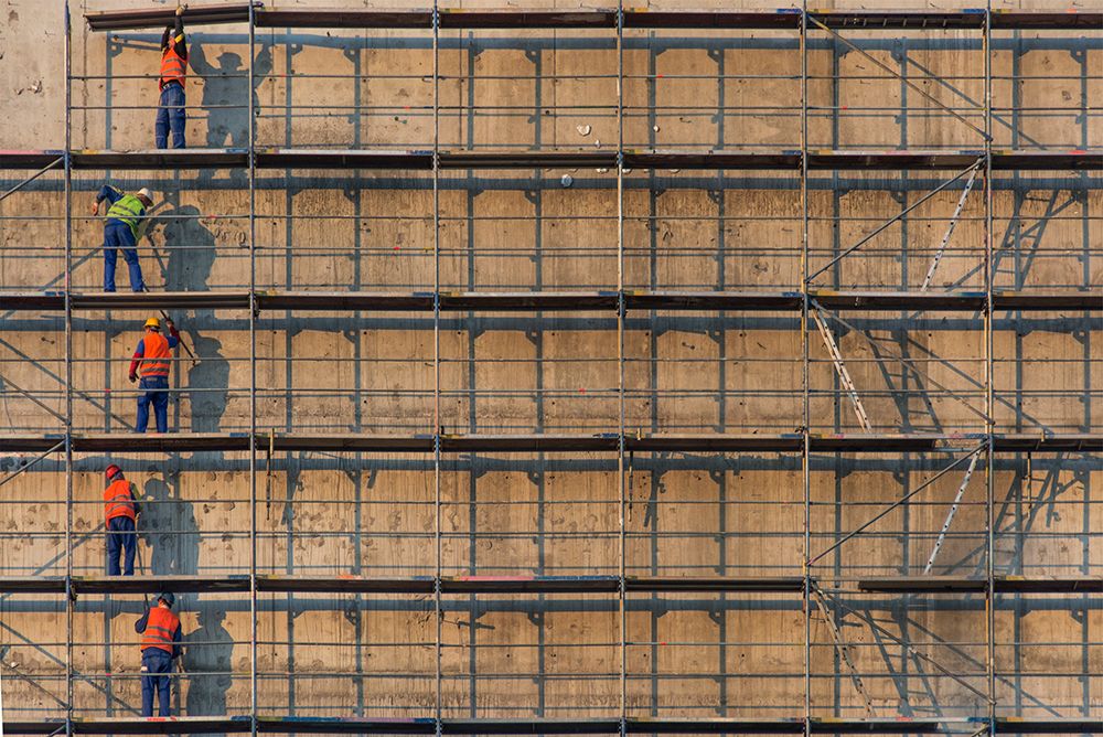 Construction workers and scaffolds
