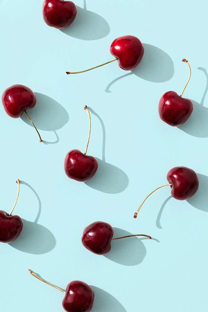 Cherries on turquoise background