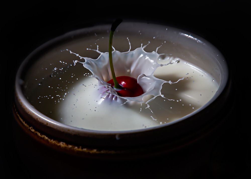 The cherry in a drop of milk