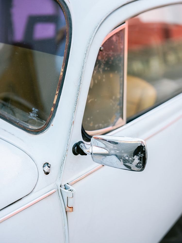 Pastel Volskwagen Beetle in the streets of Oaxaca Mexico