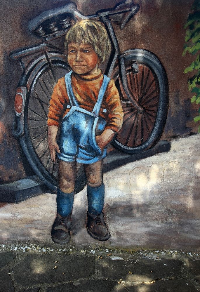 Murals painting with a child and a bicycle