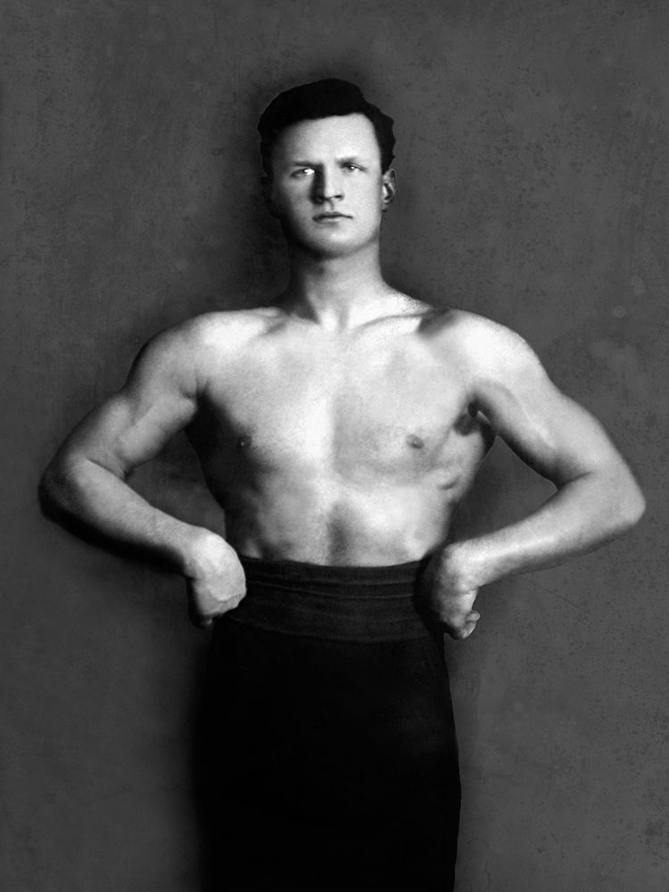 Bodybuilder in Pants with Bared Torso