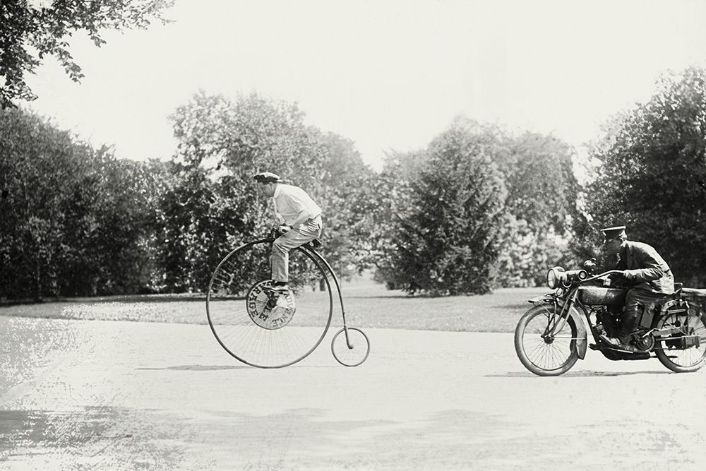 Motorcycle cop chases a Penny Farthing Velocipede
