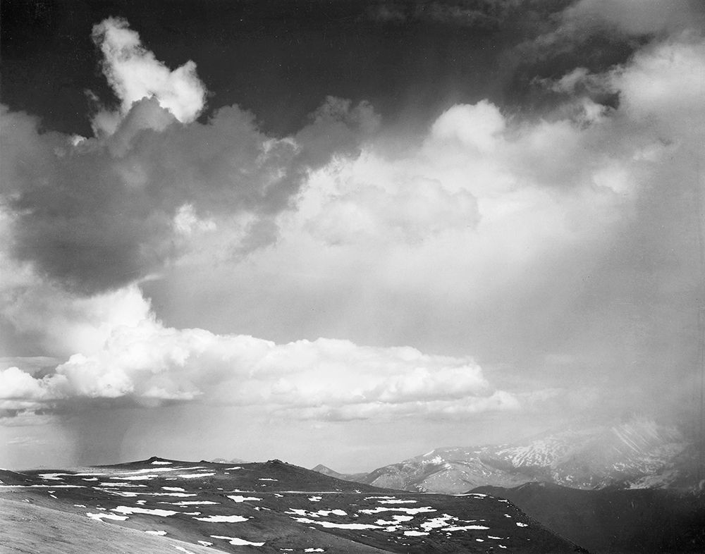 Mountain tops, low horizon, dramatic clouded sky, in Rocky Mountain National Park, Colorado,  ca. 19