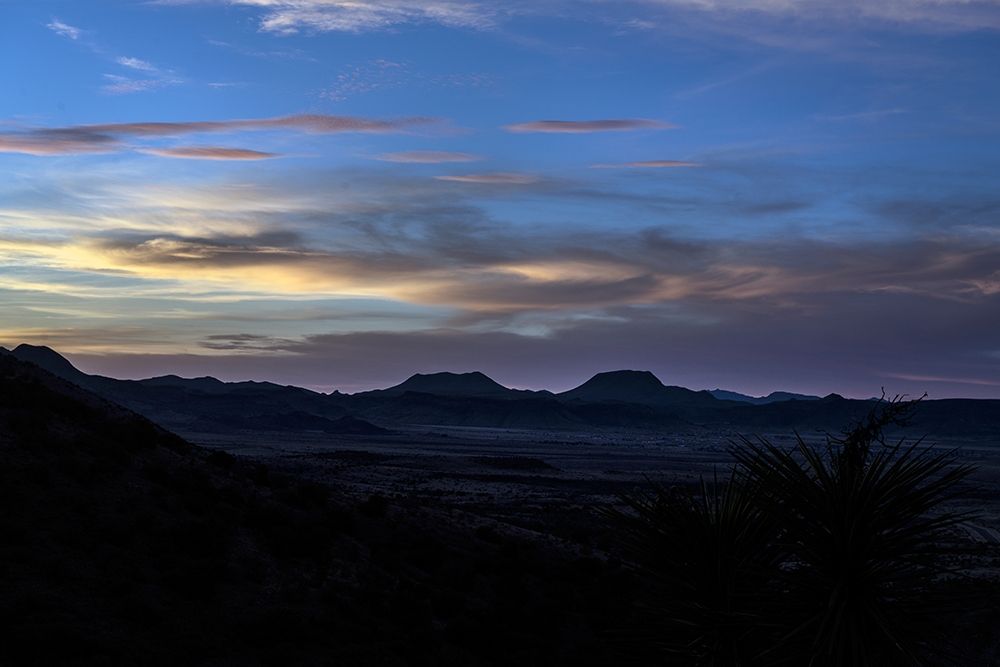 Sunset over the low mountains in the rugged terrain north of Big Bend National Park in the Trans-Pe