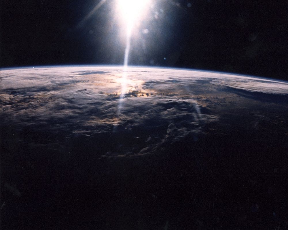 Sunlight over Earth as seen by Discovery crew