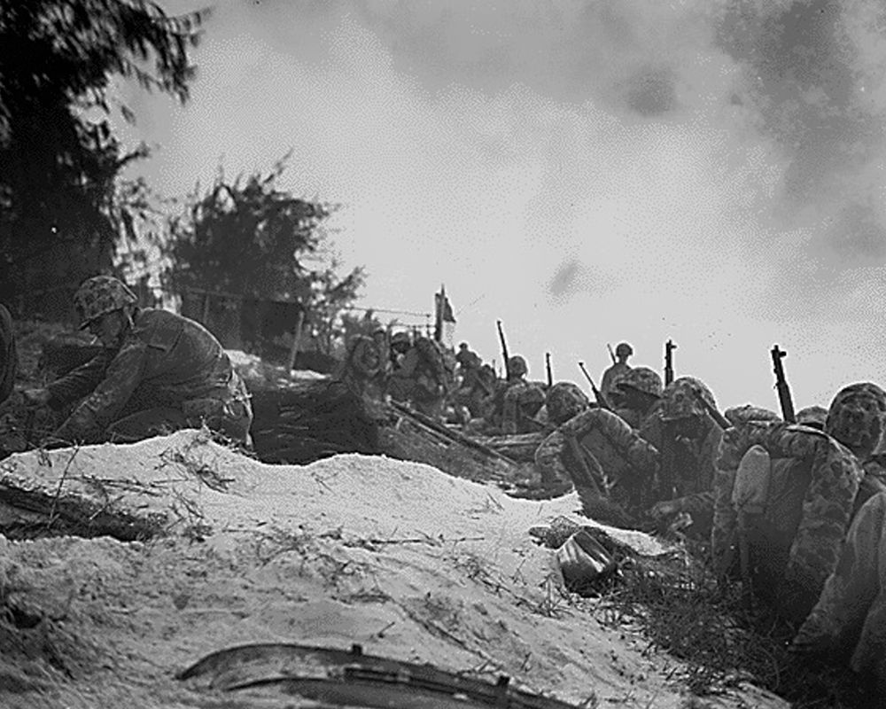WWII assault troops await orders D-day at Saipan in the Marianas