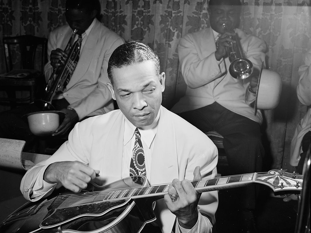 Fred Guy playing guitar at the Aquarium-New York 1946
