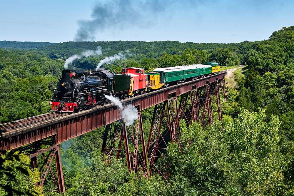 A steam train crosses the 156-foot-tall Bass Point Creek Bridge-Iowa