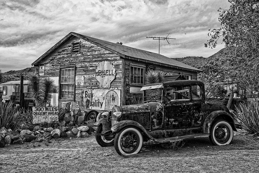 Vintage Car in Front of Old Gas Station