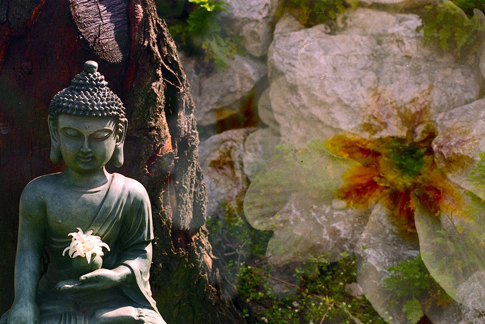 Green Buddha Statue with Flower