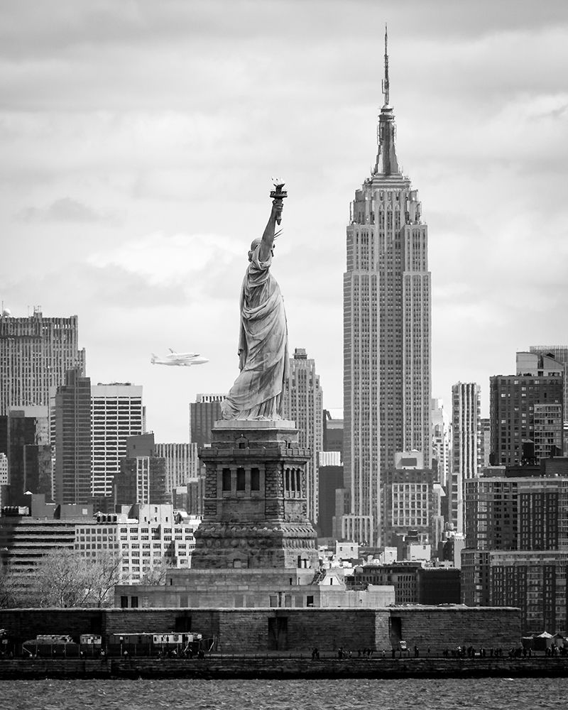Space Shuttle Enterprise - atop a 747 carrier seen behind the Statue of Liberty