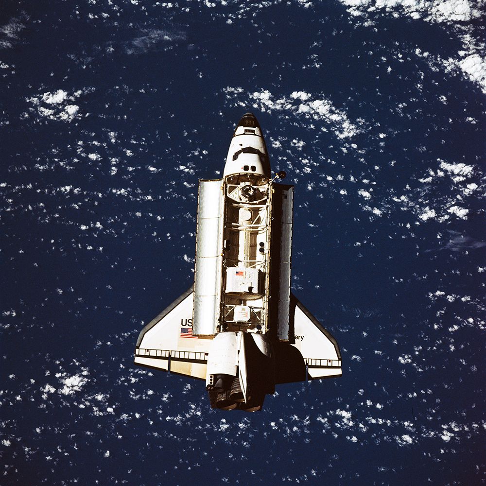 The Space Shuttle Discovery approaches Russias Mir Space Station