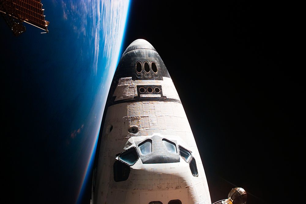 View of Orbiter Nose and Earth Limb